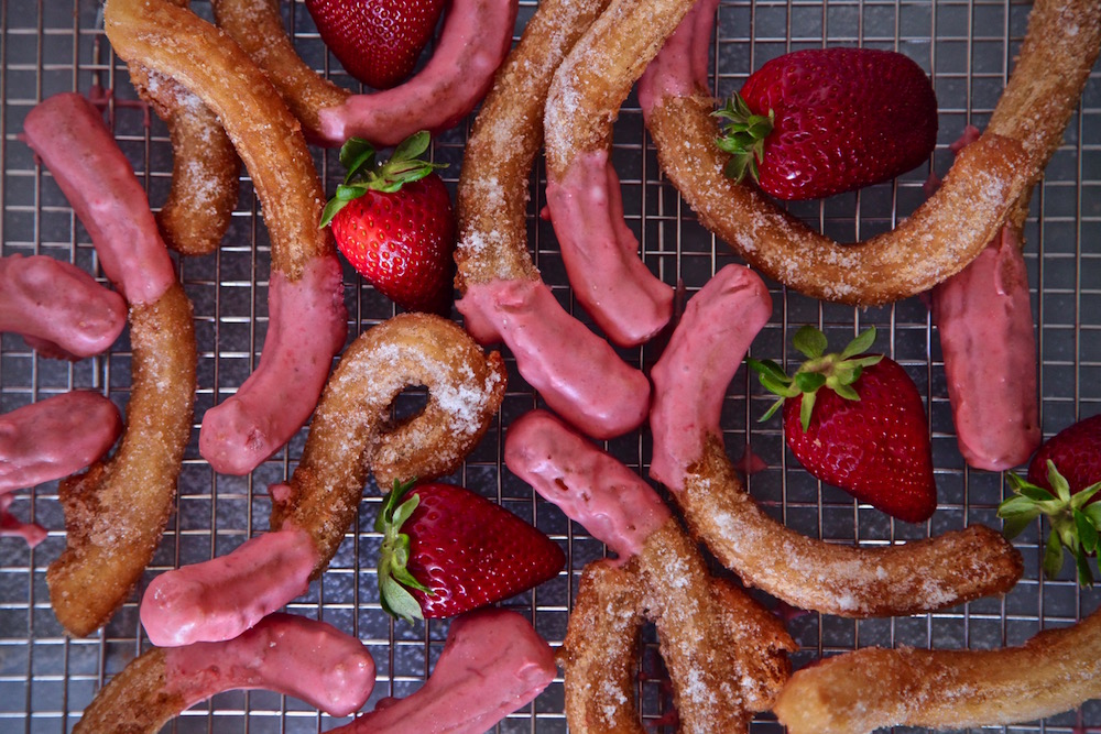 Strawberry churros all dusted in sugar
