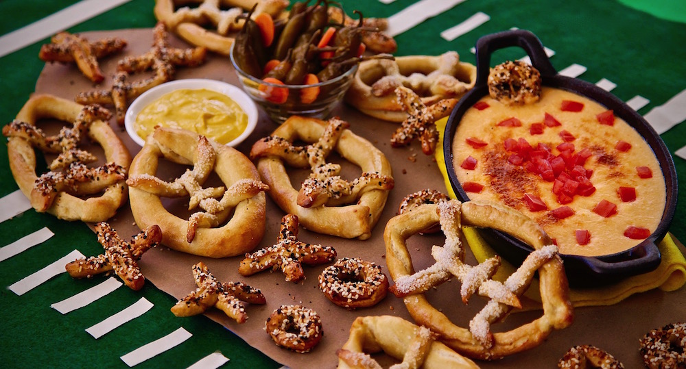 Football shaped pretzels served with a Mexican Beer Oaxaca Cheese Dip. Absolutely delicious combination of my american culture and my ever present Mexican culture. 
