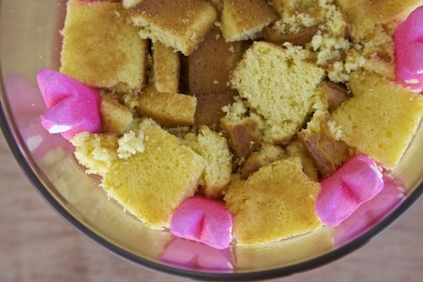 Filling the center of a trifle with cubed cake