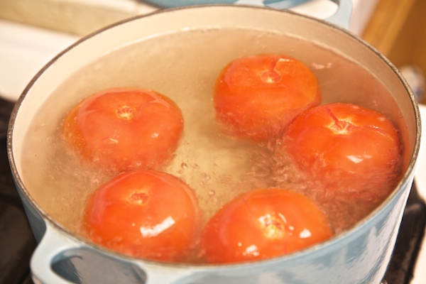 Boil tomatoes for salsa