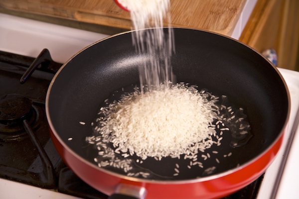 rice being fried for Mexican rice 