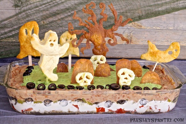 A Halloween graveyard bean dip. This dip makes for a great centerpiece until your ghostly guests are ready to eat.