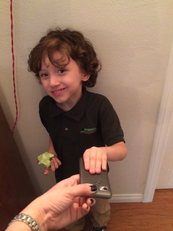 Max welcoming his new phone.