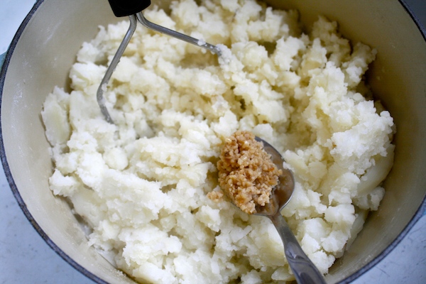 add in minced garlic to mashed potatoes
