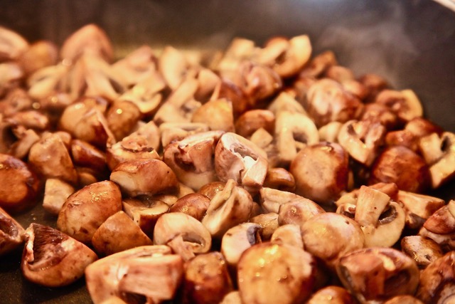 baby bella mushrooms cut in fours and sauteed for vegan menudo