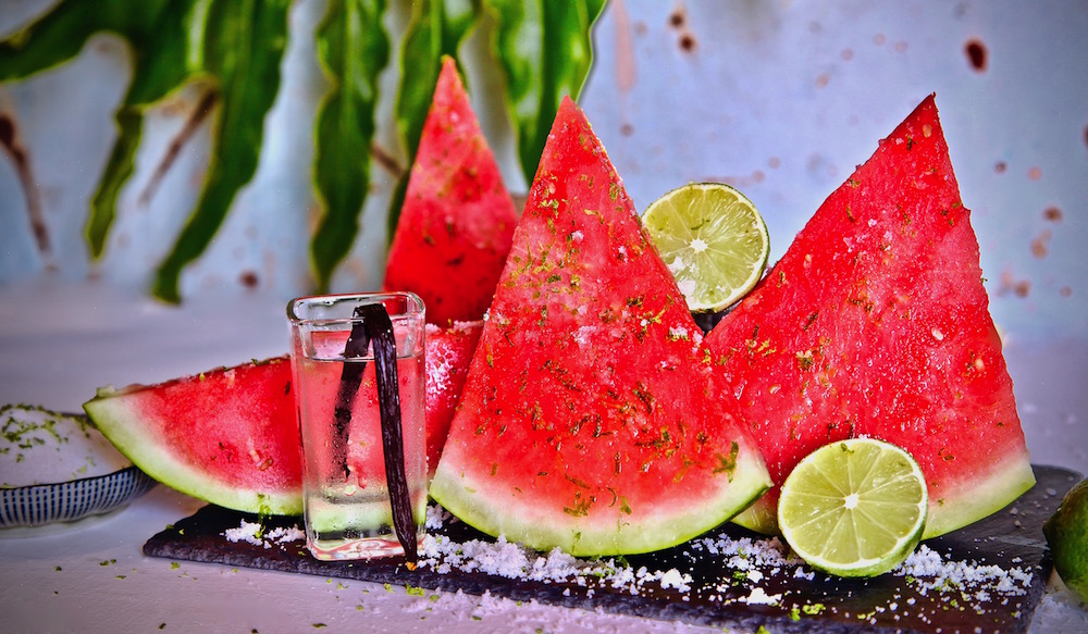 Vanilla vodka infused watermelon sprinkled in lime sugar is the perfect deconstructed cocktail to serve at your next party.