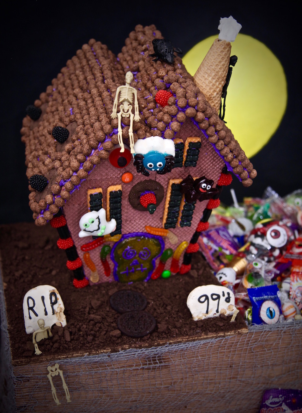 Epic Haunted house graveyard Halloween Candy box made with everything from the 99 cents only stores. 