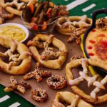 Football shaped pretzels served with a delicious Mexican Beer Oaxaca Cheese Dip