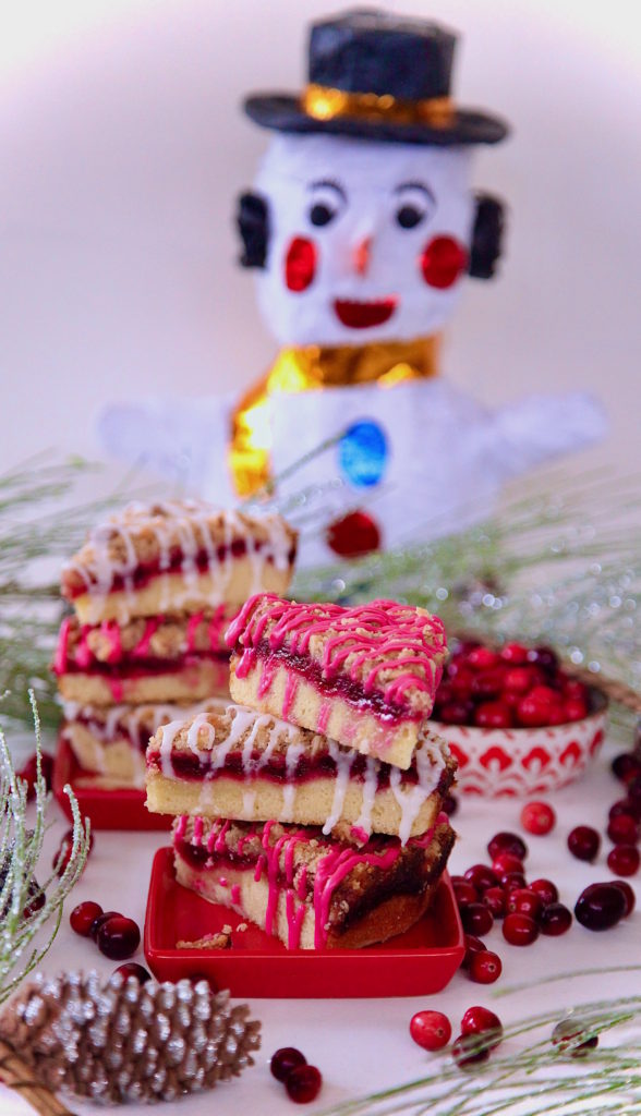 Snowman wanting to eat the cranberry coffeecake dressed in hibiscus glaze.